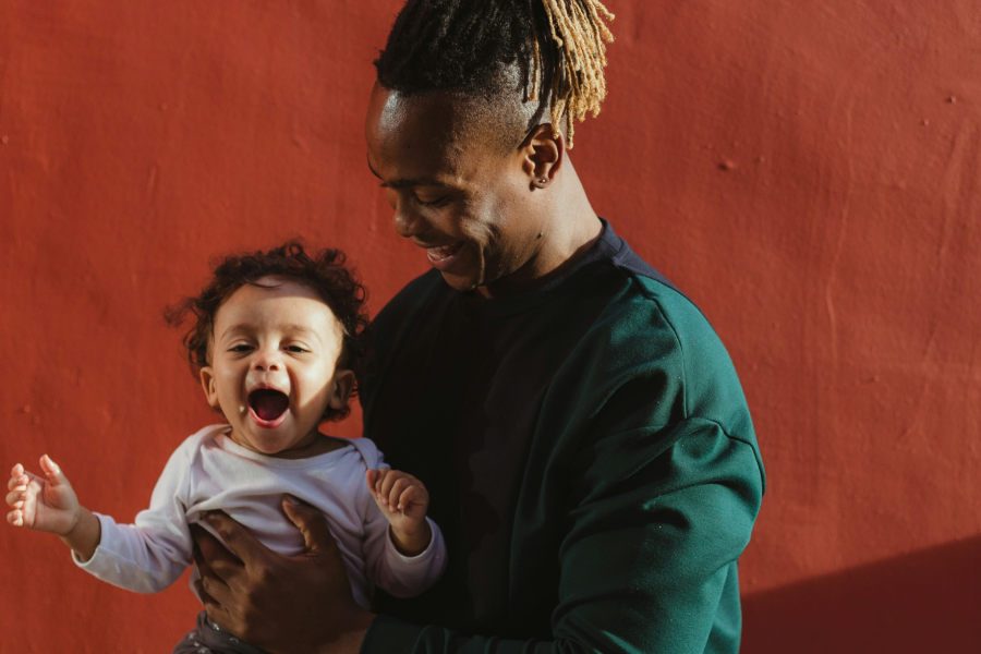 A man and a baby and some project screenshots